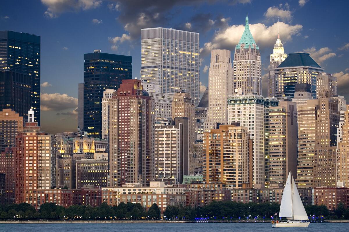 A sailboat against the backdrop of the big city