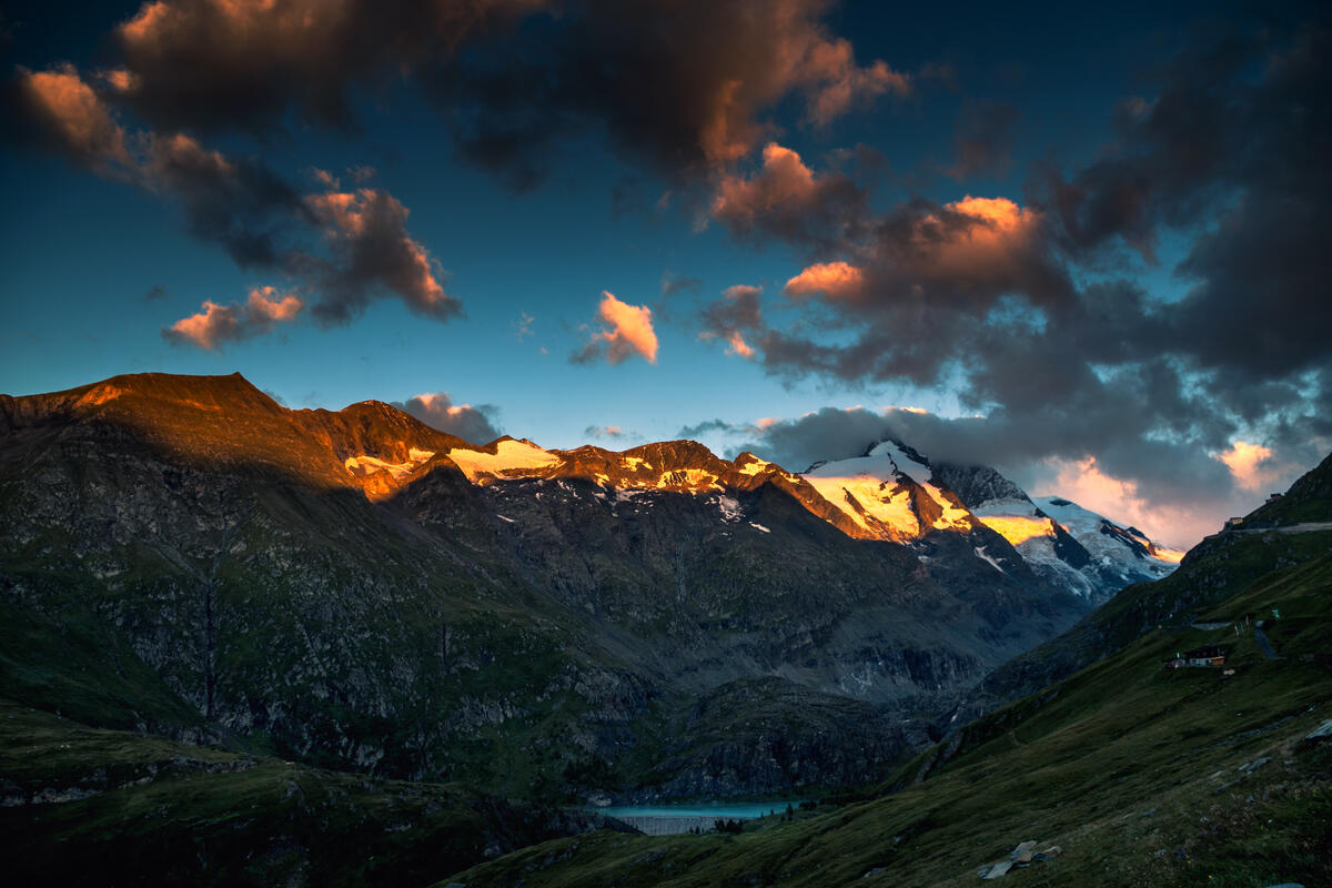 Sunset in the mountains with snowy peaks