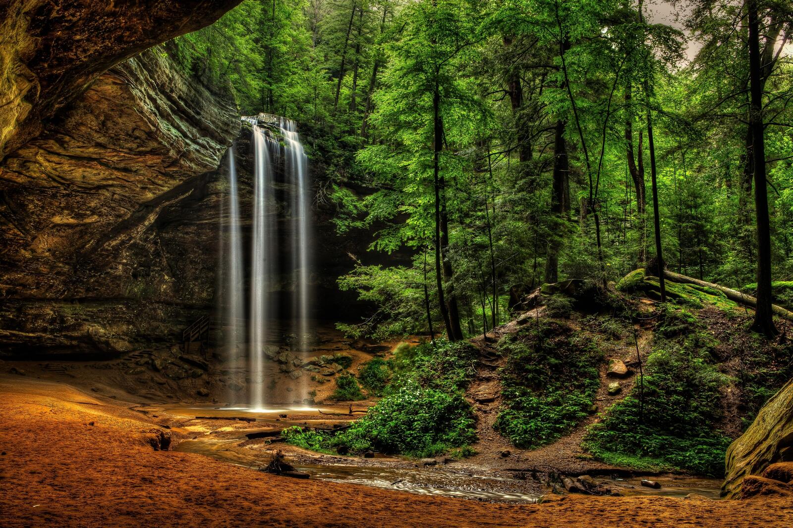 Free photo Wallpaper with a small waterfall in the forest