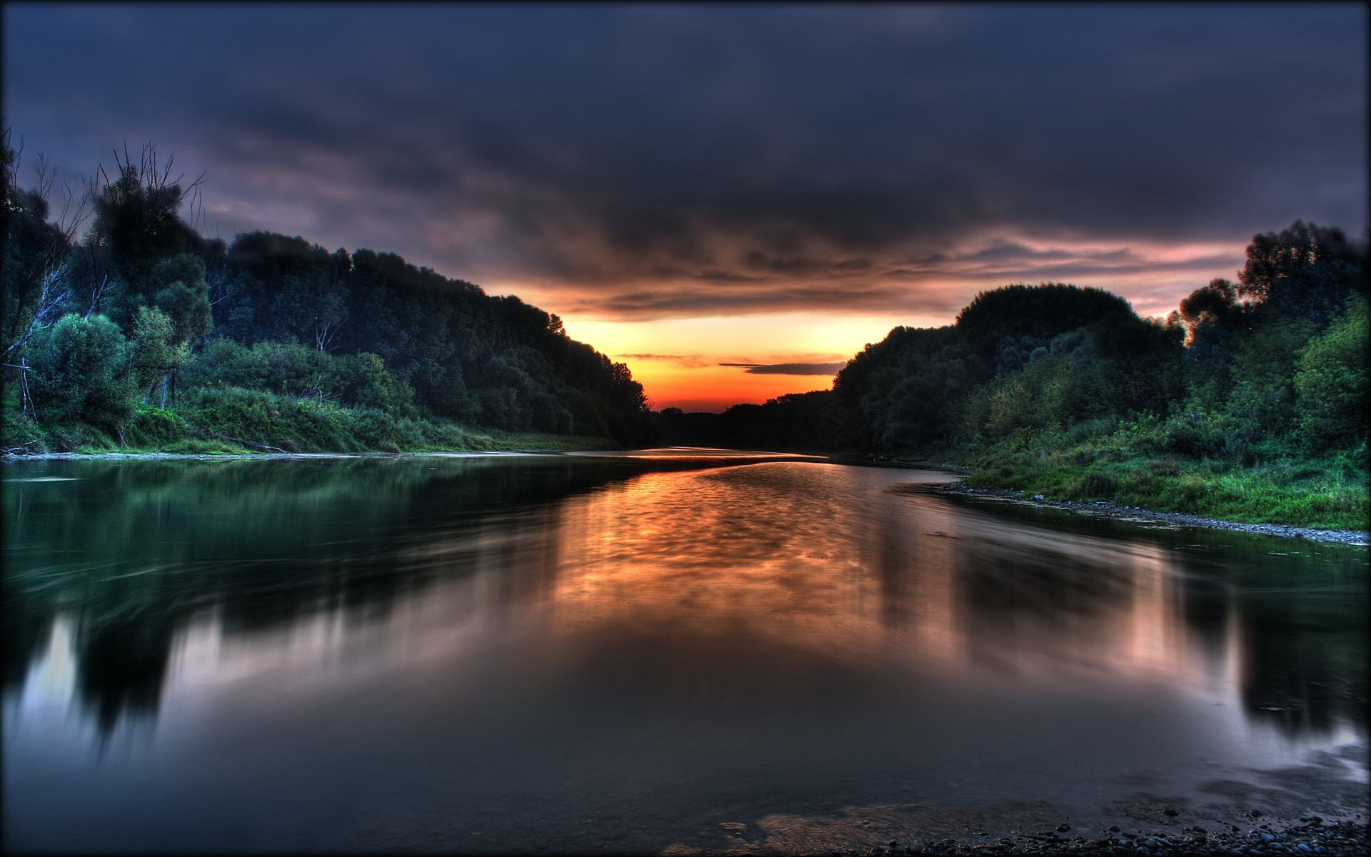 The sunset is reflected in the river