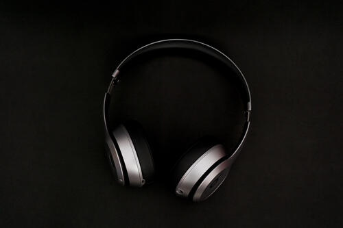 Metal headphones on a black background