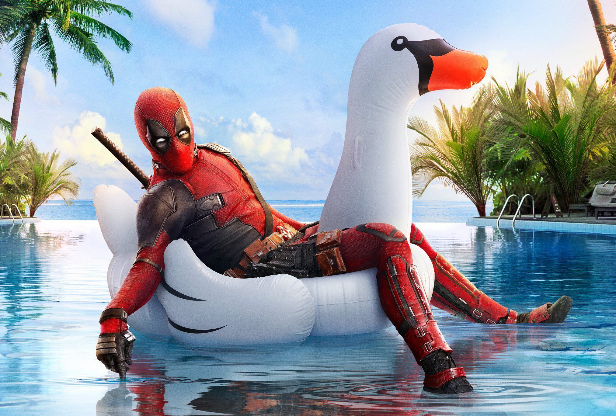 Free photo DeadPool 2 rides an inflatable swan in the pool