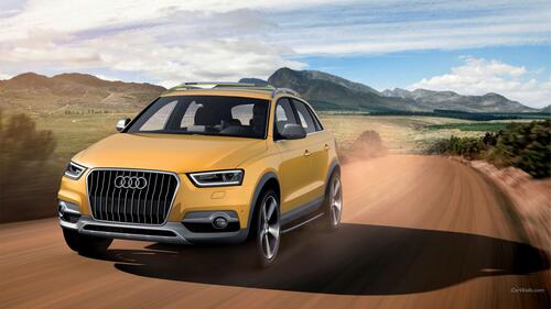 Audi Q3 driving on a dusty road