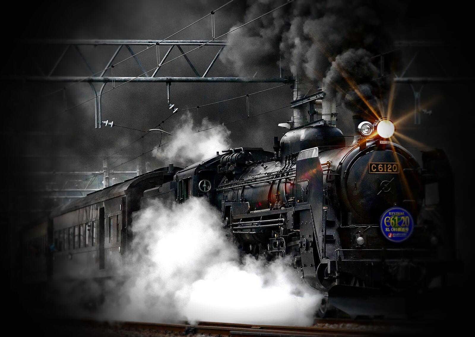 Free photo An antique steam locomotive with black smoke coming out of its chimney.