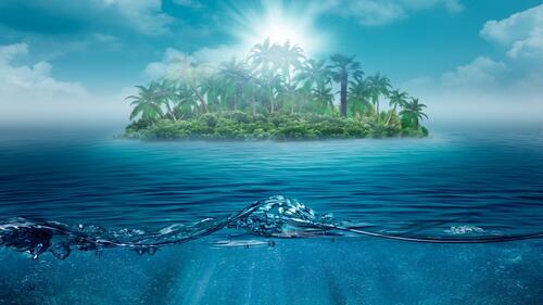 An island in the ocean on a sunny afternoon