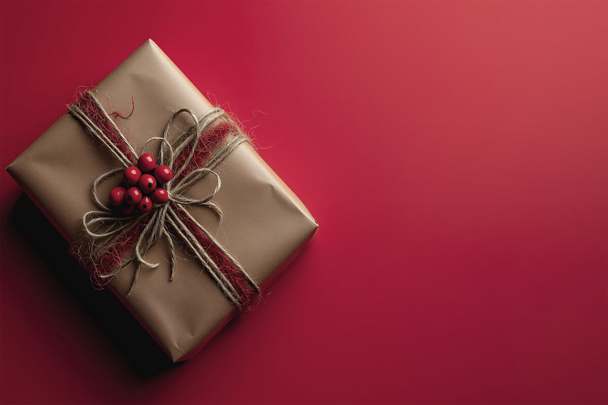 A wrapped gift on a pink background