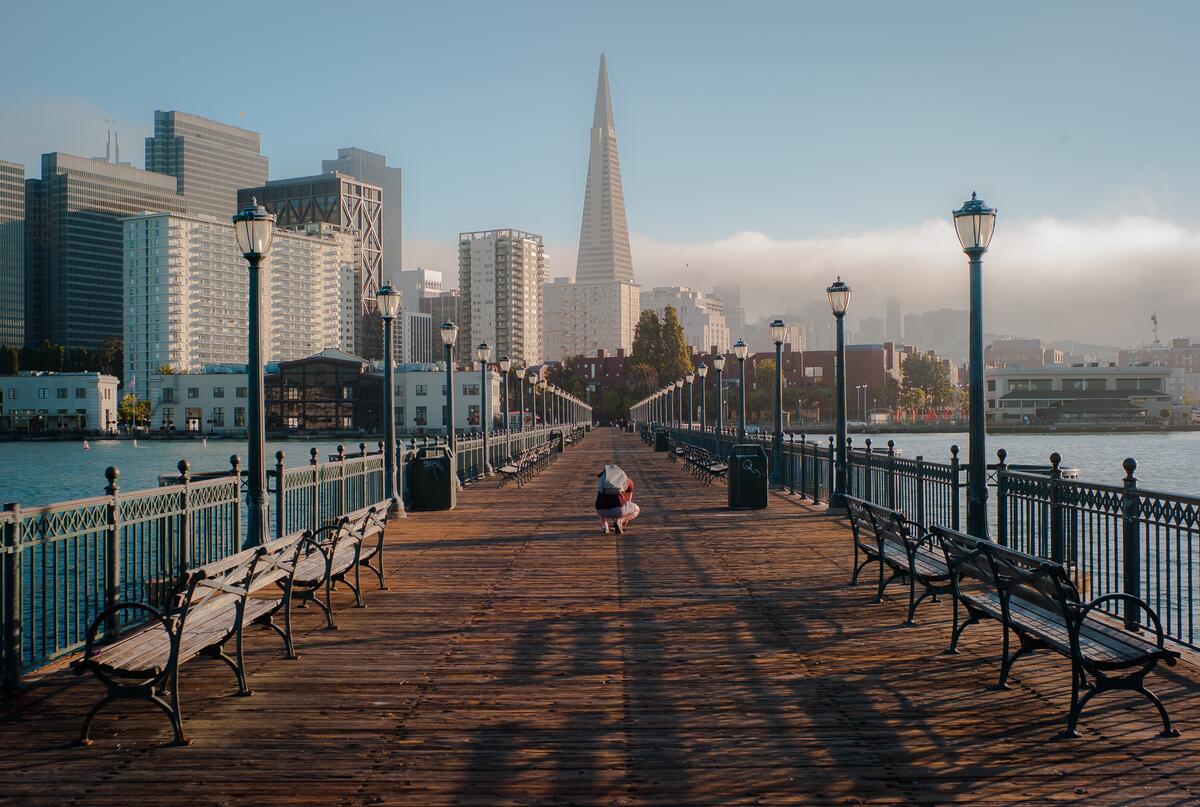 A deserted pier with the city as a backdrop