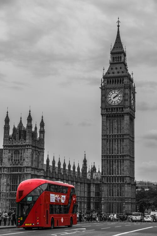 A red bus against the backdrop of London`s Big Ben