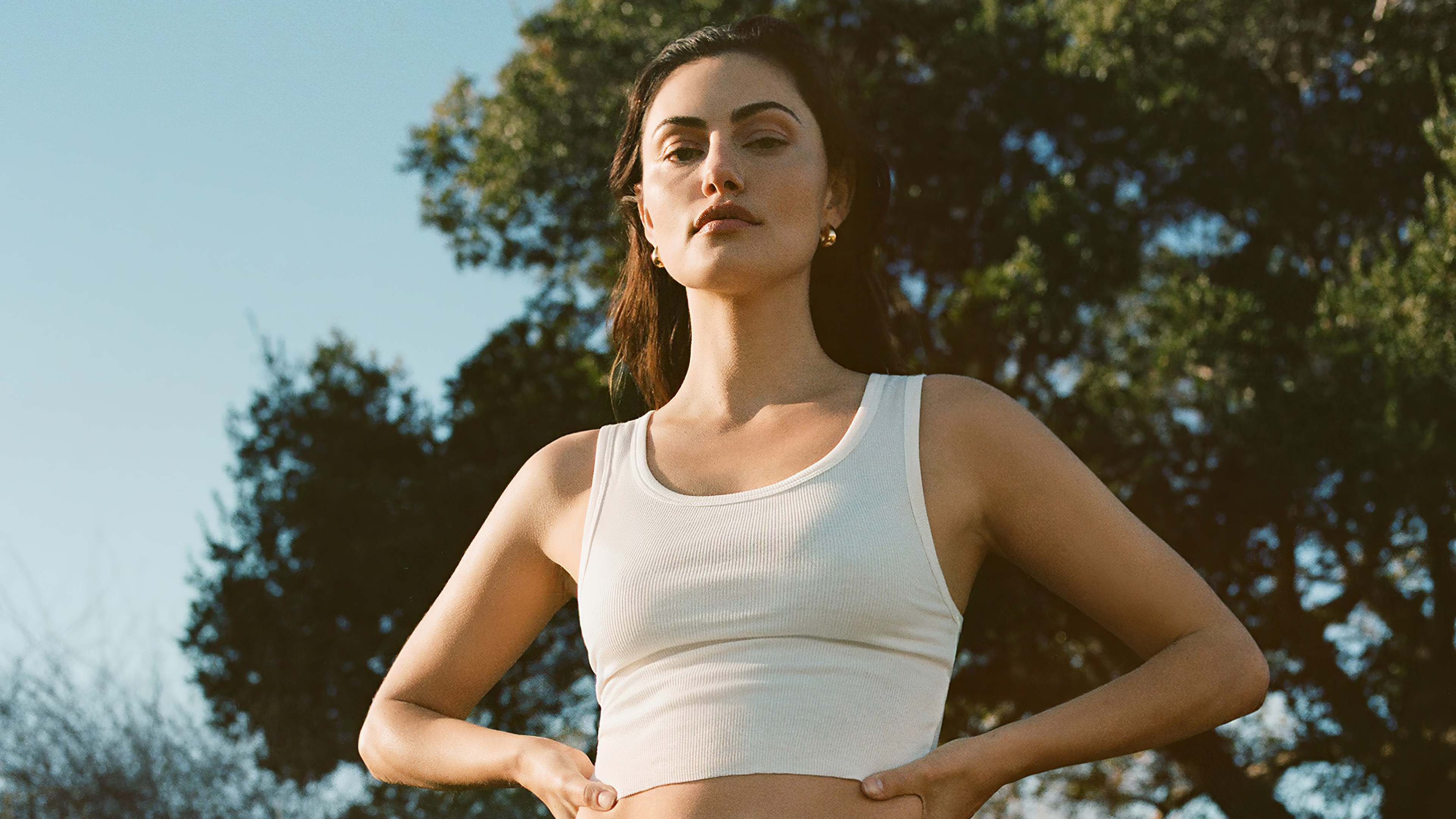 Portrait of Phoebe Tonkin in a short white top