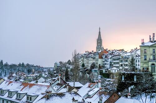 A beautiful city with old buildings under the freshly fallen snow