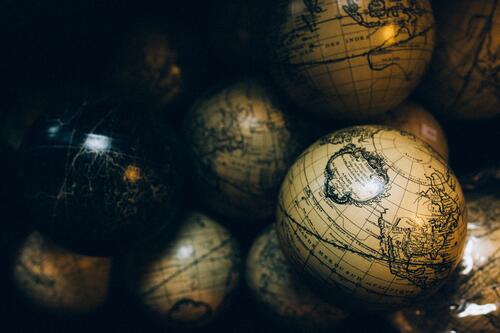 Balls keychain with antique world map