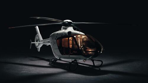 Modern helicopter on a dark background