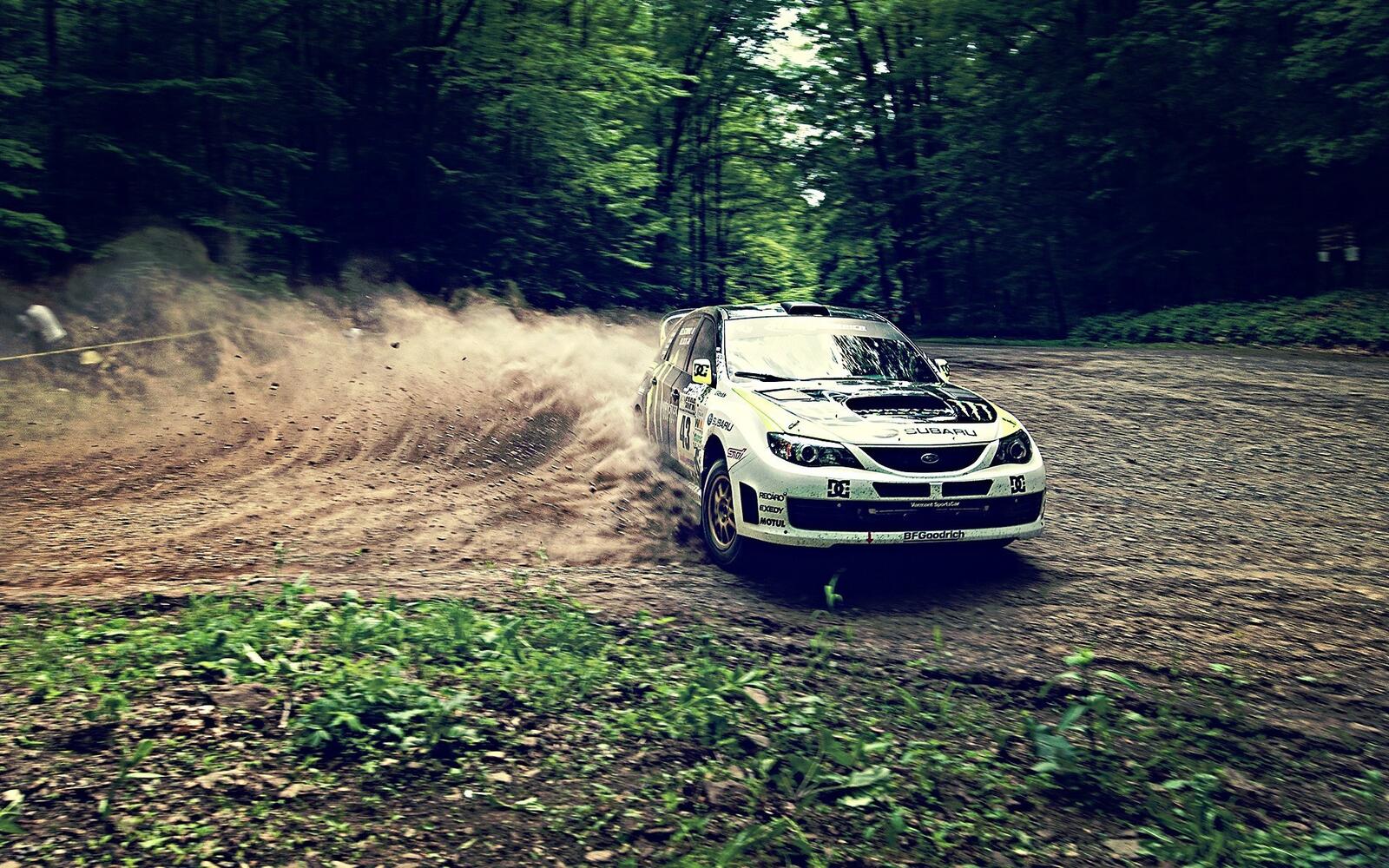Free photo Sideways through the dust in a Subaru