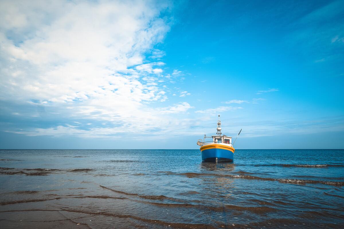 An old fishing boat by the ocean