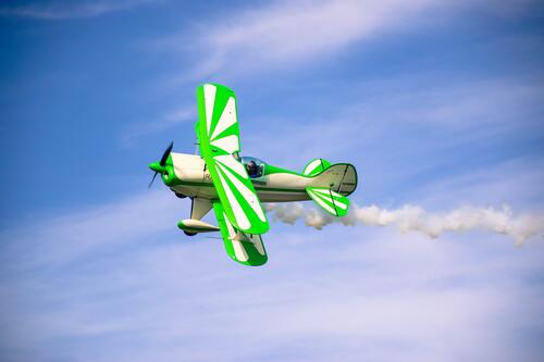 A green cornplane in the sky