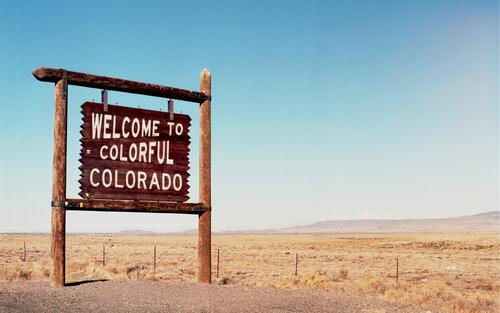 A wooden sign in Colorado