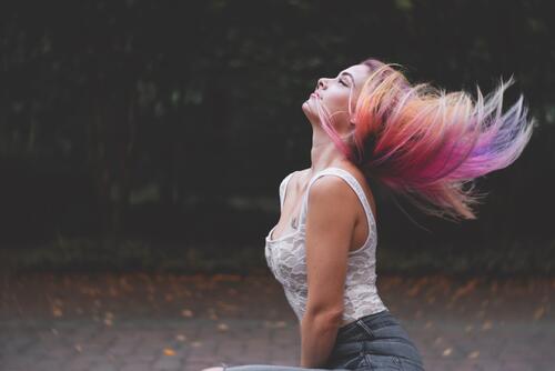 A girl with colored hair in the wind