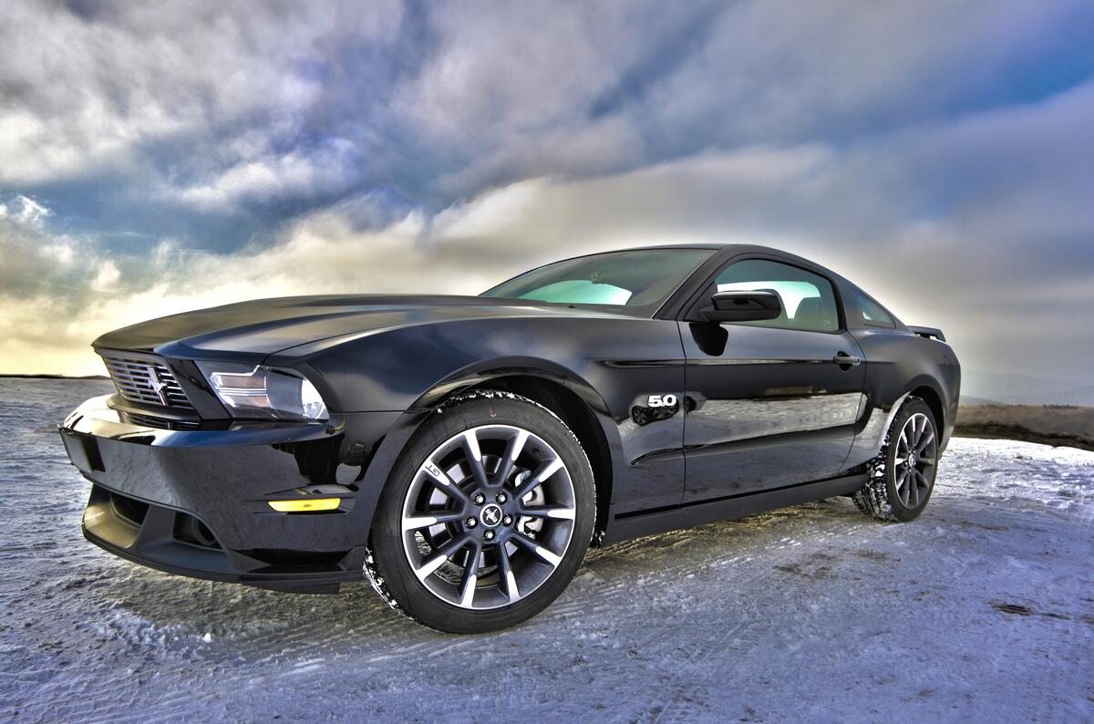 Black Ford Mustang GT in the snow