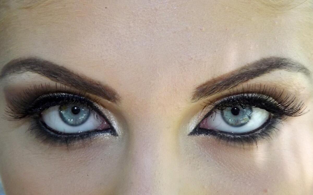 Eyebrow and eyelash makeup with blue eyes