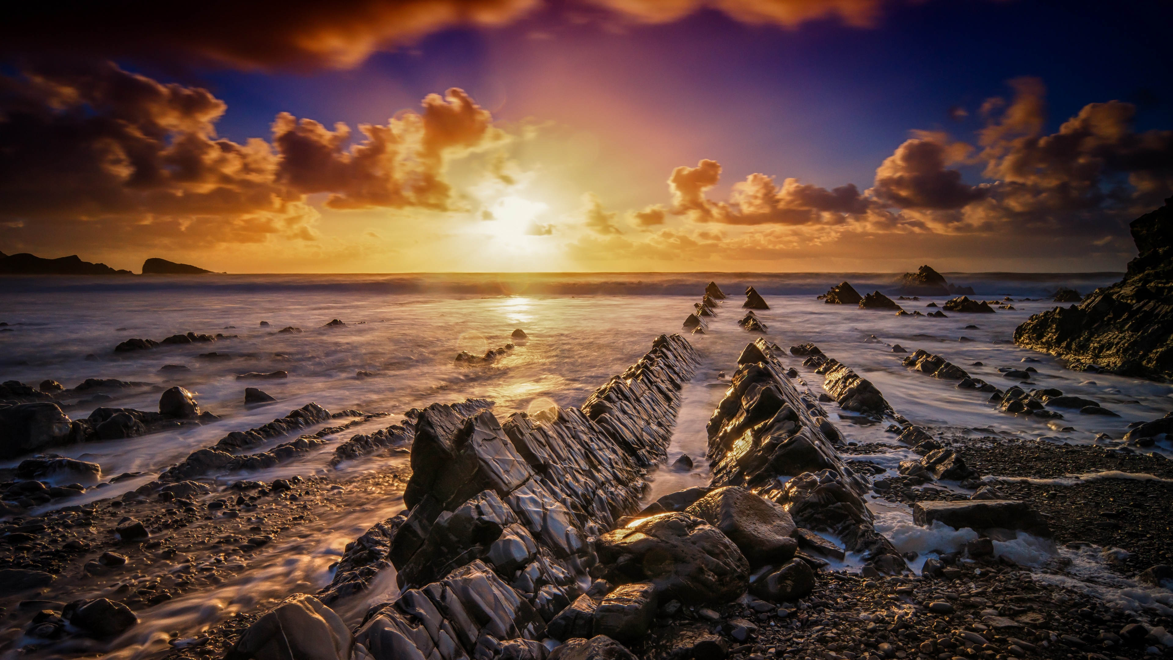 免费照片海边的夕阳与海边的悬崖峭壁