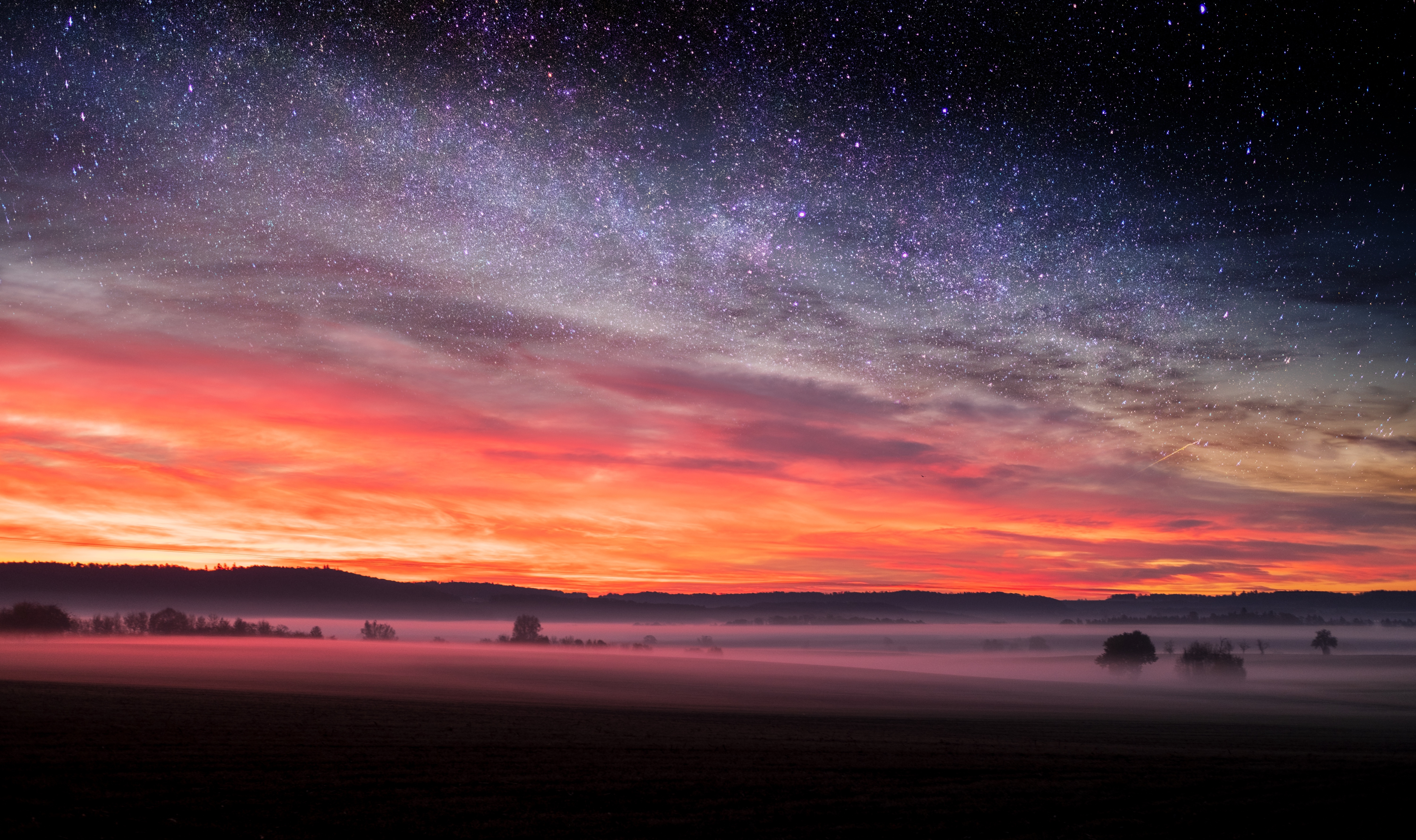 Free photo Sunset with a starry sky
