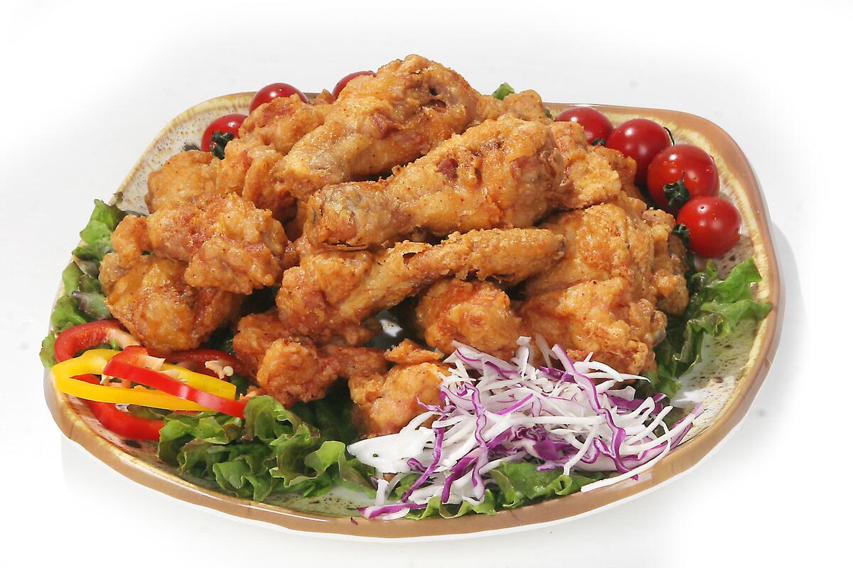Delicious wings with greens from kfc.