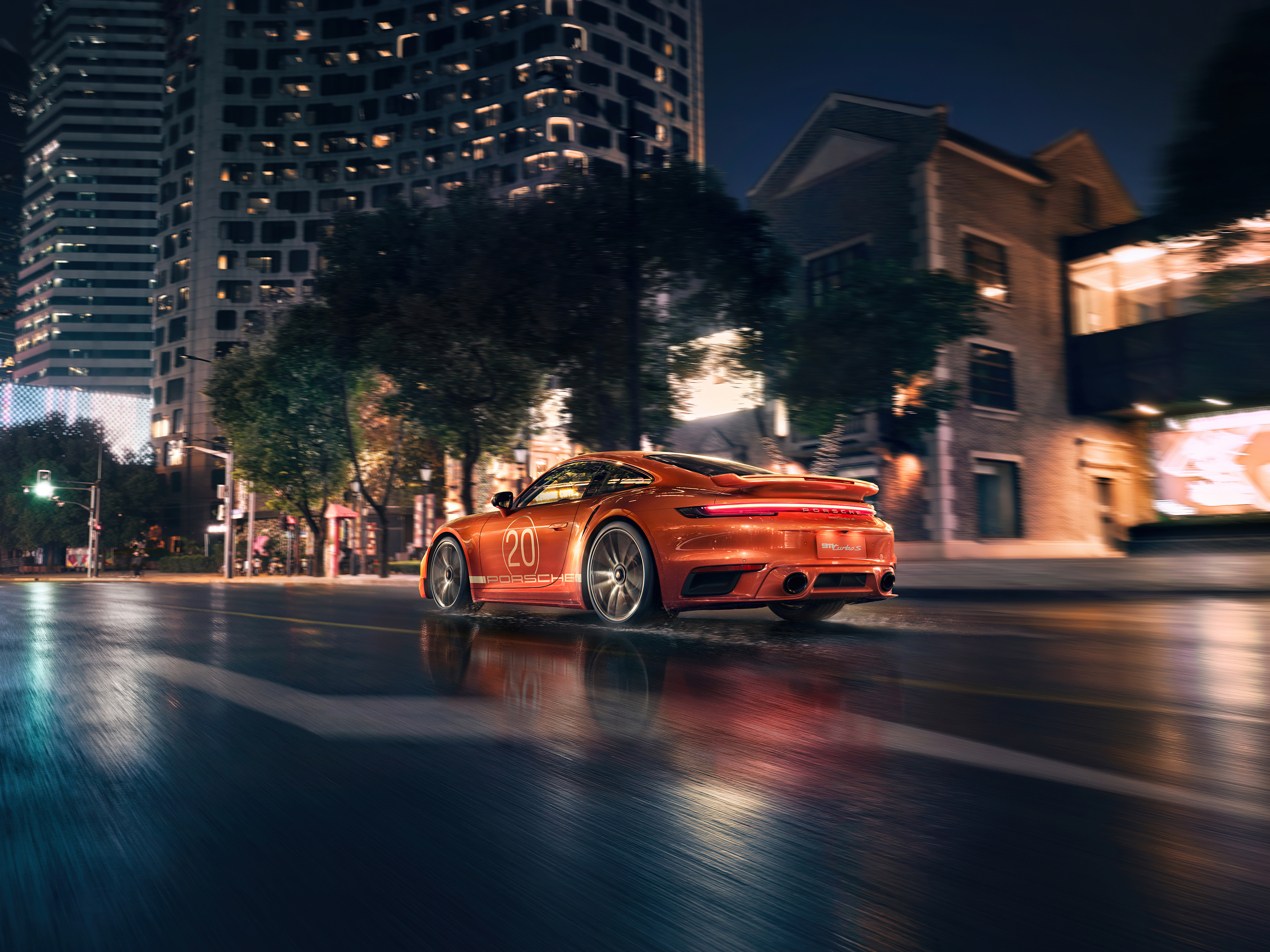 Free photo Orange Porsche rushes through the city at night