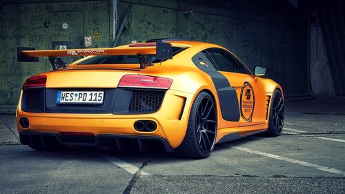 Audi R8 in orange color on sporty wheels