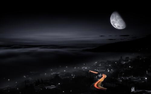 Wallpaper depicting the moon over a city at night
