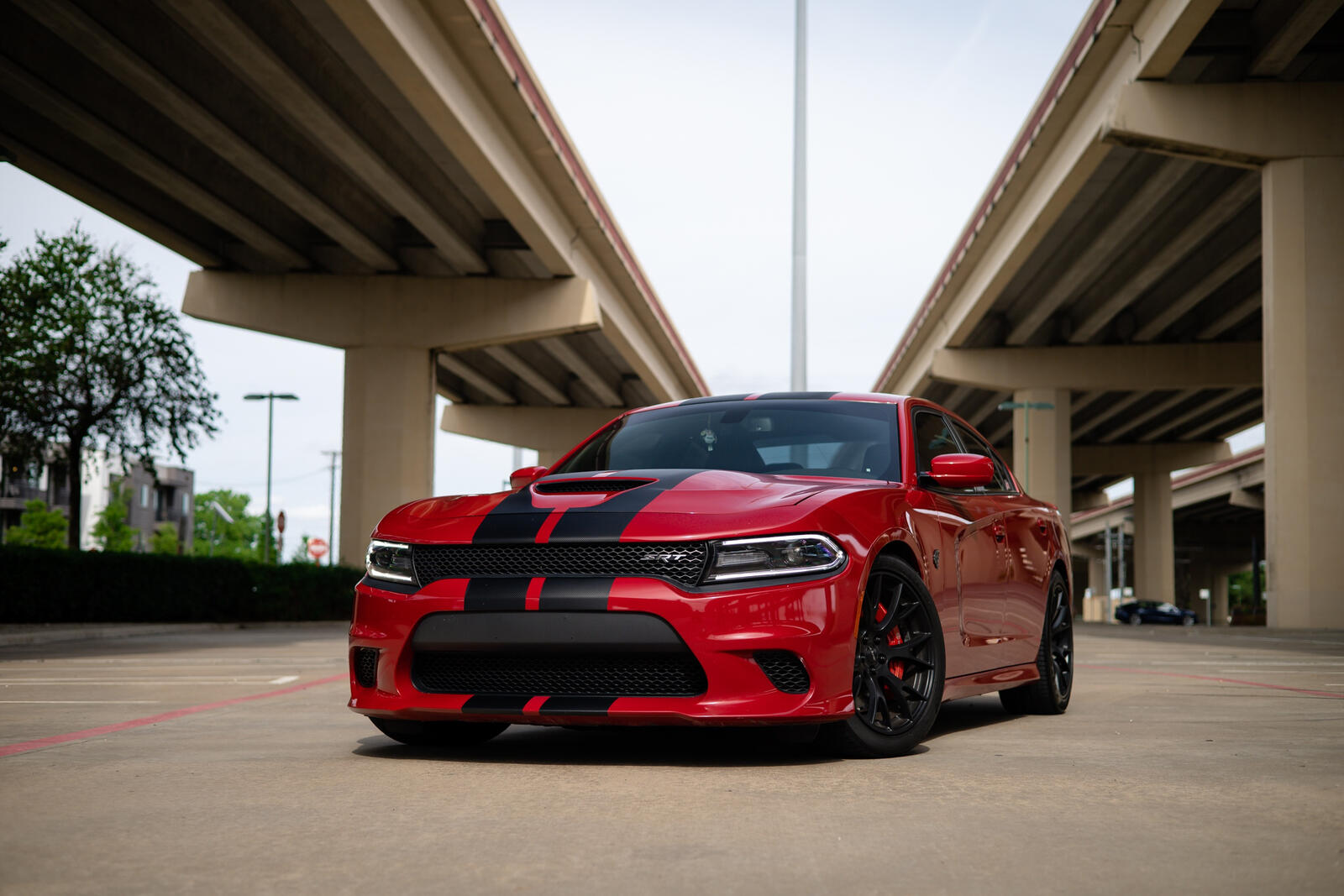 Free photo Cherry dodge charger srt hellcat with black stripes