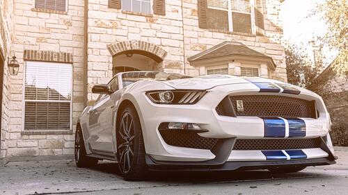 White ford mustang shelby gt350 with blue stripes
