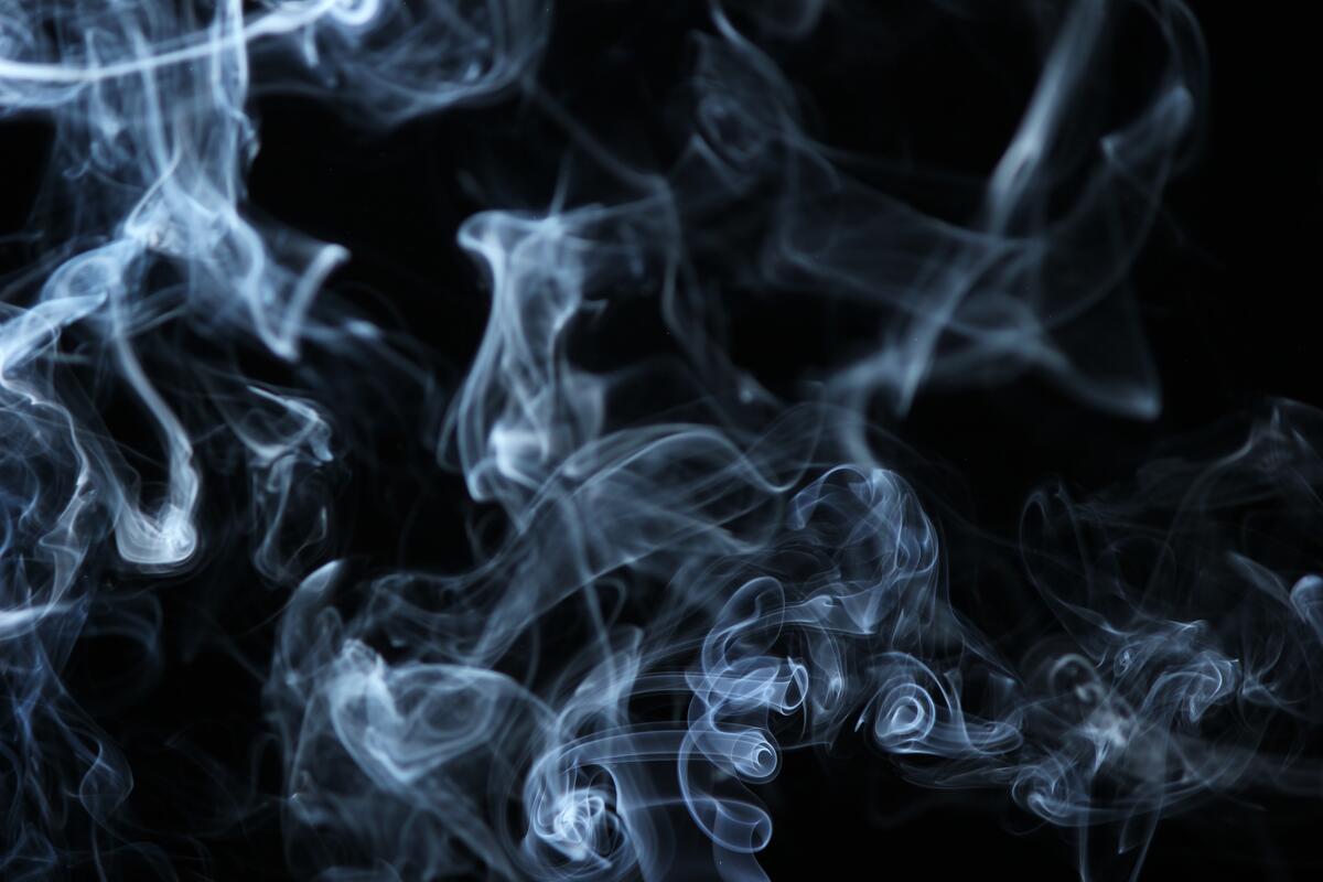 Cigarette smoke on a black background