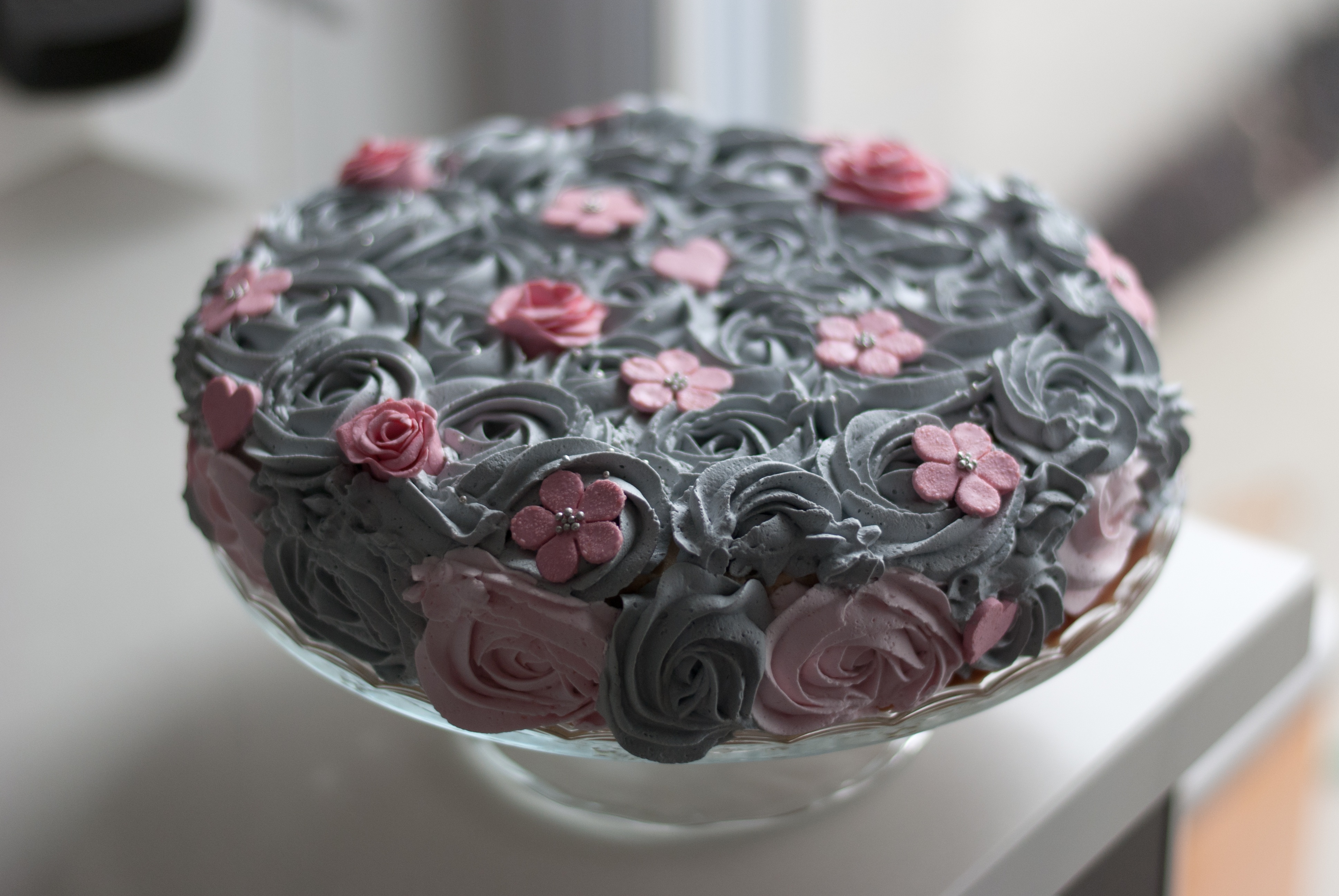 Delicious cake decorated with icing flowers
