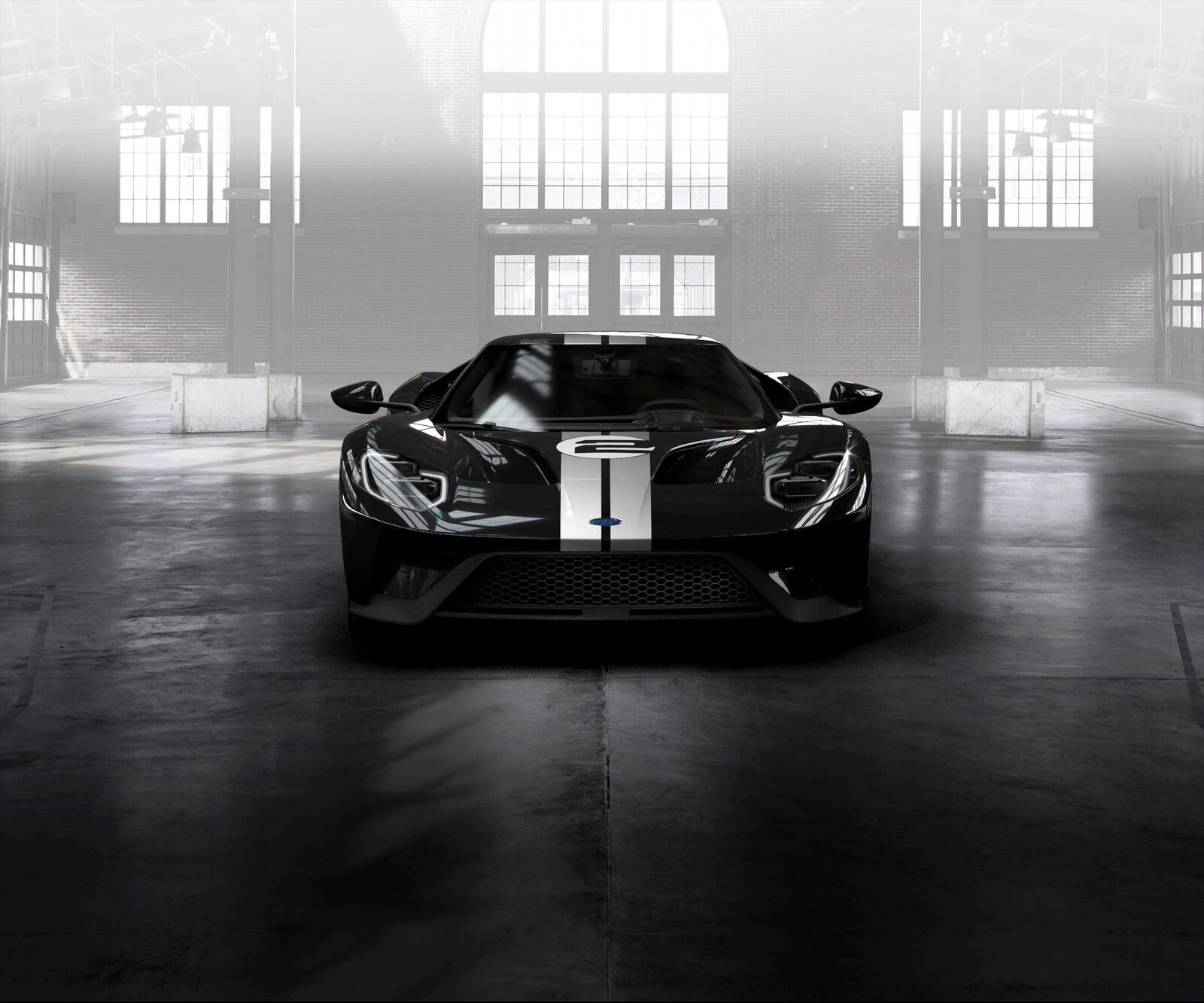 Free photo Black ford gt in a big hangar in the sunlight