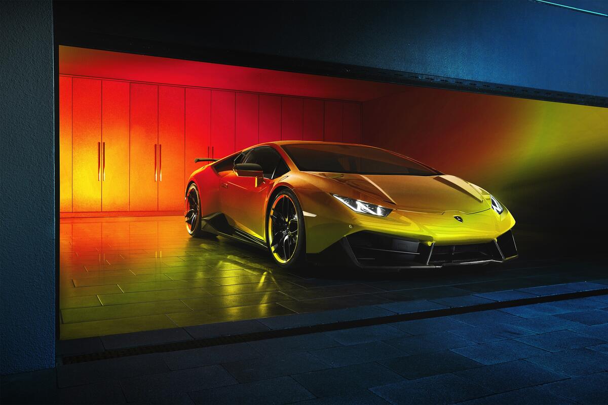 A yellow Lamborghini in a big garage