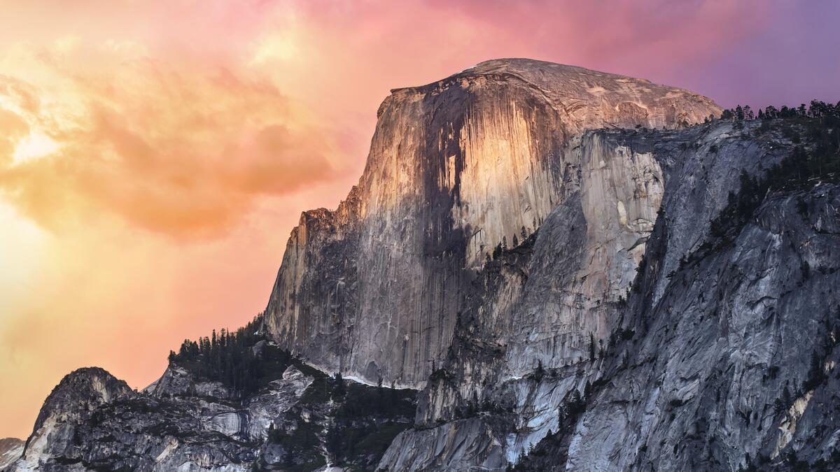 A mountain in Yosemite Park with a colorful sky