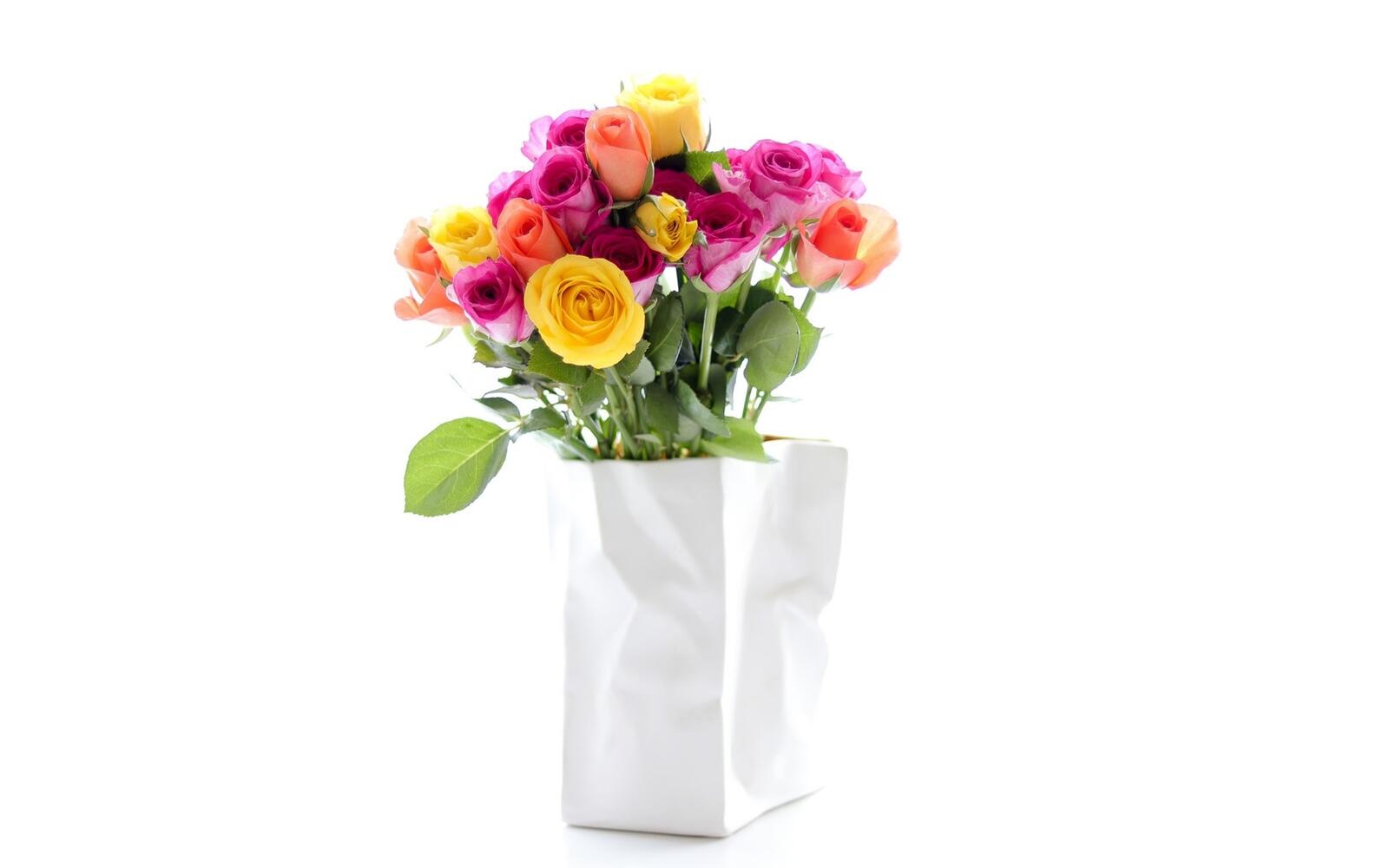 Free photo Bouquet of colorful roses on a white background