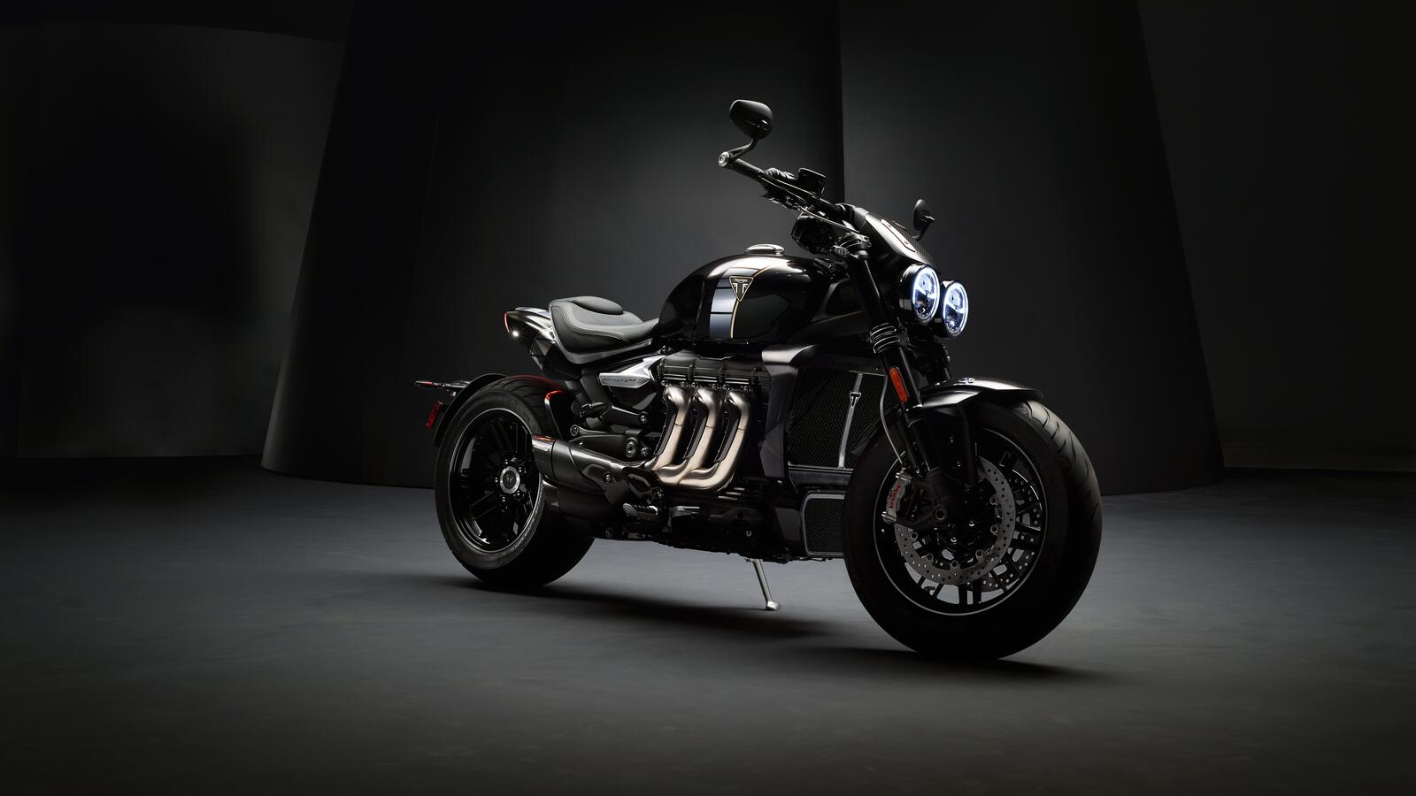 Free photo Triumph Rocket 3 - TFC in the black room stands in the light
