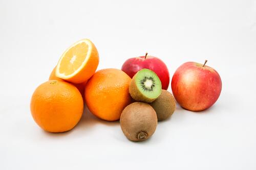 Ripe fruit on white background