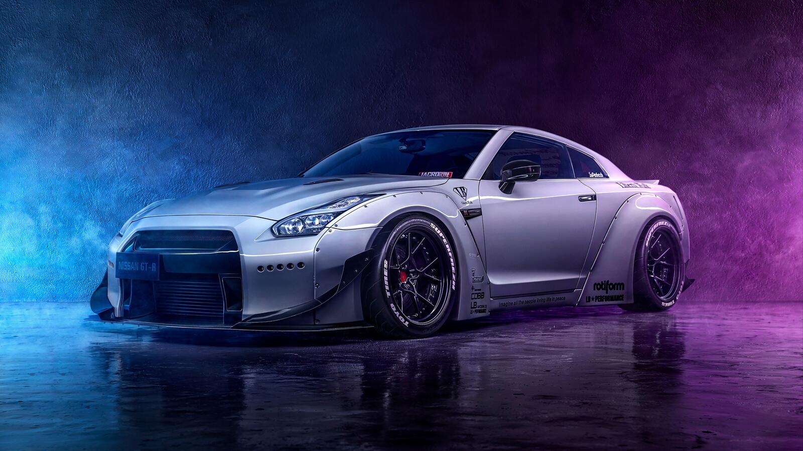 Free photo A white Nissan gtr in a smoky room
