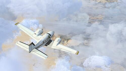Белый самолет летит над облаками
