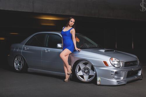 Girl posing at the Subaru