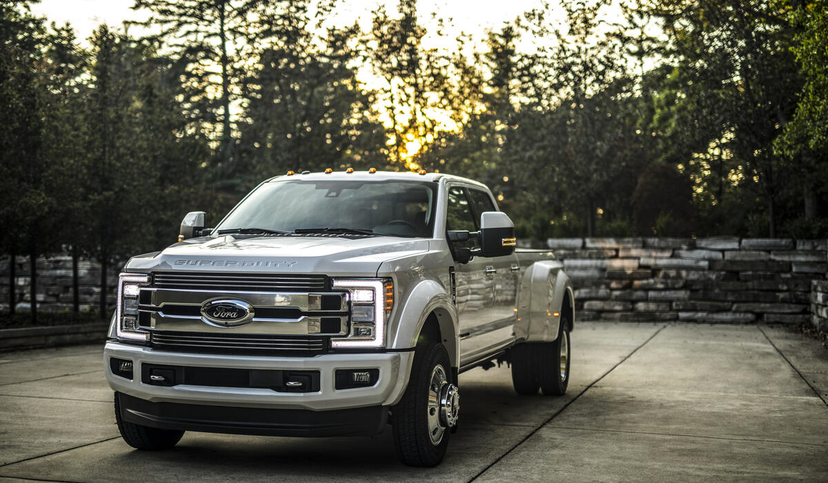 A silver Ford F450 pickup truck.