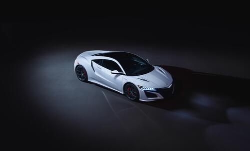 Acura nsx in white photographed in the dark