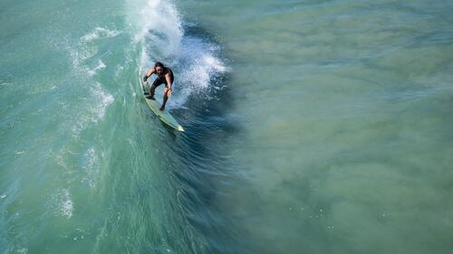 Surfer on a high wave
