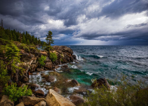 Beautiful cloudy sky on the rocky shore of the lake