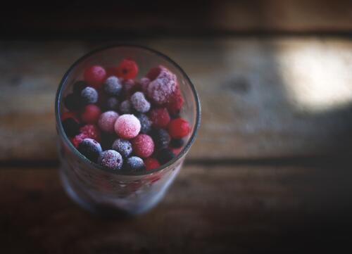 Frozen berries in a glass.