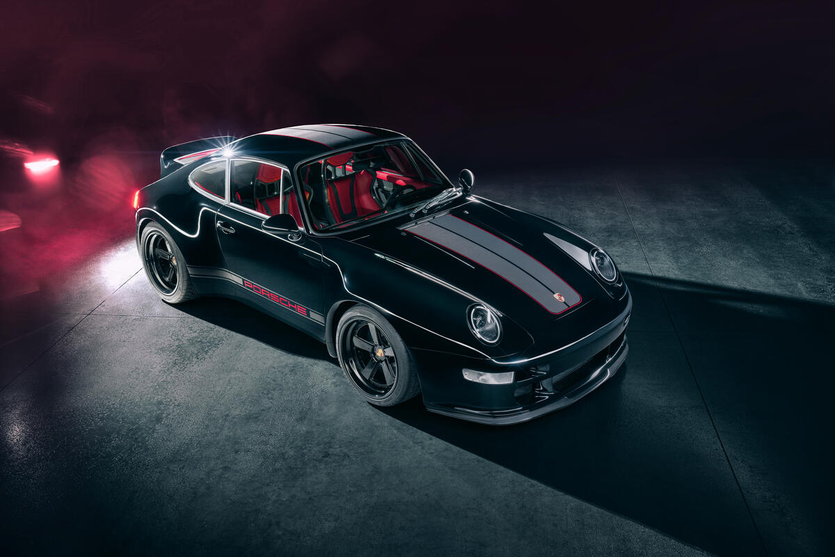 A Porsche 911 in a darkened room