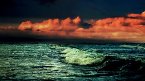 Sea waves near the shore at sunset