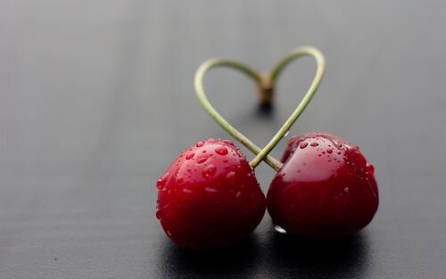 Two wet cherries